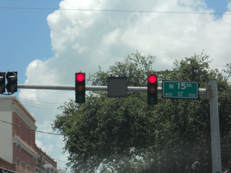 The gray box between these traffic signals, shows a NO TURN arrow when a streetcar or light rail train approaches the area. Photo taken by HARTride 2012