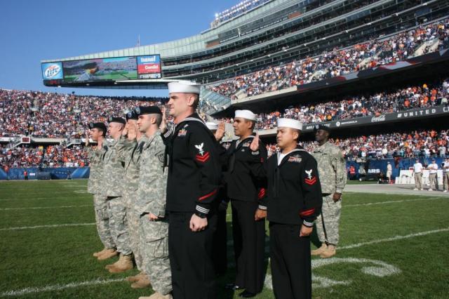 Military members can always be seen at major sporting events, especially during the playing of our National Anthem. Photo Credit: US Army.